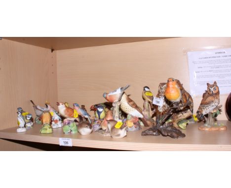 A collection of Royal Worcester bone china garden bird ornaments, various, a Crown Staffordshire porcelain model of a standin