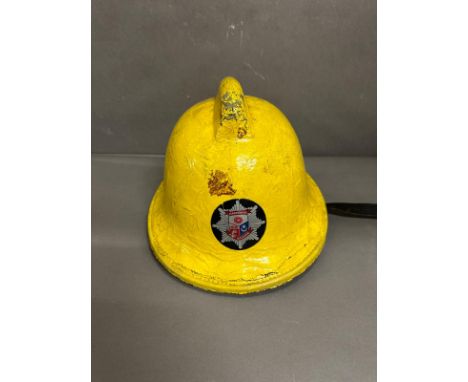 A vintage Hampshire fire mans helmet 