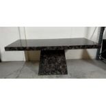 A black marble pedestal dining table (H77cm W180cm D100cm)