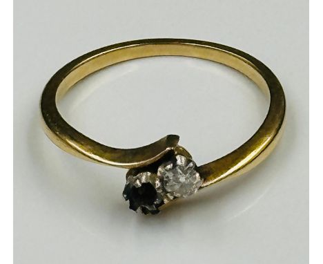 A 9ct gold AF diamond crossover ring, one missing stone, approximate weight 2.5g and size O