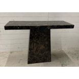 A black marble pedestal console table (H120cm W140cm D40cm)