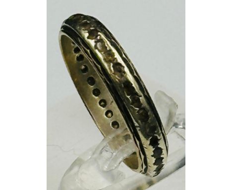 A 9ct gold ring, approximate size N, eternity ring style.
