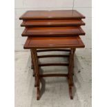 A nest of four side tables on splayed legs and turned spindle supports by Bradley (H60cm W58cm