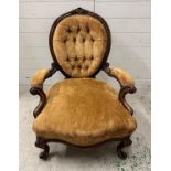 A Victorian walnut button back ladies chair n a brown velvet upholstery