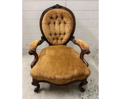 A Victorian walnut button back ladies chair n a brown velvet upholstery 
