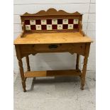 A pine washstand with tiled back (H110cm W92cm D47cm)