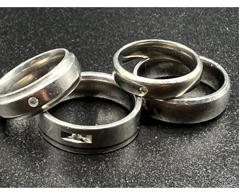 A selection of four titanium wedding bands