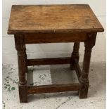 A square oak stool on turned legs with cross stretchers (H46cm W53cm D30cm)