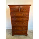 A mahogany veneered tall boy with two short drawers over five long (H133cm W76cm D49cm)