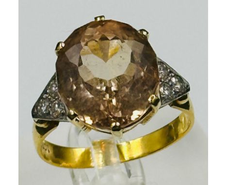 An 18ct gold set fancy ring with diamond shoulders, approximate weight 7.3g and size U