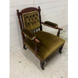 A Victorian upholstered elbow chair