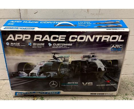 A Scalextric Arc one Formula one track and cars 