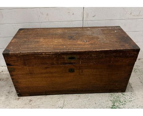 A campaign style camphor wood trunk with brass handle and brass detail to corners, opening to storage and internal candle box