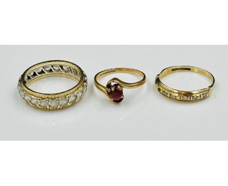 Three 9ct gold rings, approximate weight of 6.1g. Clear stone eternity ring size M, clear stone partial eternity ring size J 