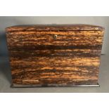 An Edwardian Coromandel stationary box, the fall front opening to a fitted interior comprising of