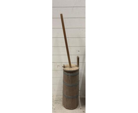A vintage metal banded milk churn 