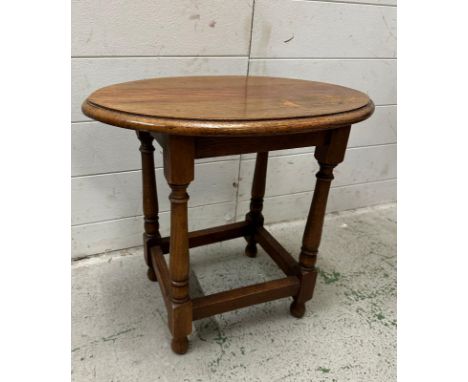 A vintage light oak oval side table (H46cm W51cm D35cm)