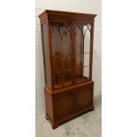 A Bradley display cabinet with cupboard under (H197cm W102cm D34cm)