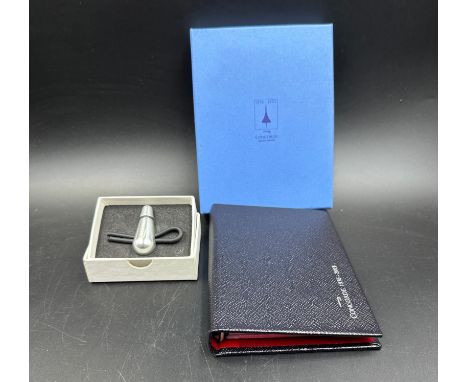 A Smythson Concorde leather ring blinder diary along with a Mach 2 keyring 