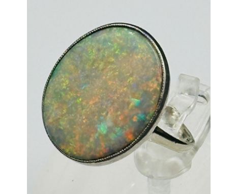 An 18ct white gold opal ring, stone 21mm in length size N and weight 5.2g
