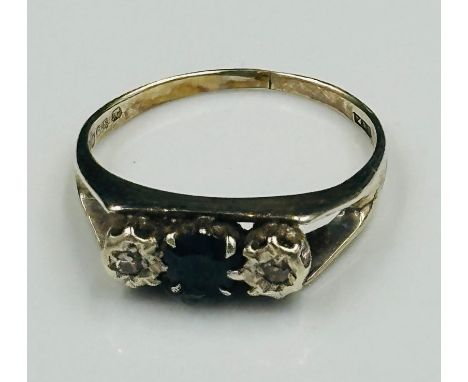 A 9ct gold ring with central sapphire and diamond shoulders, approximate size O and 2.5g.