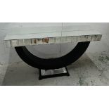 A contemporary mirrored console table