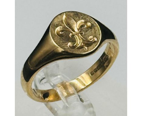 A 9ct gold signet ring with a Fleur De Lis, approximate weight 5.9g