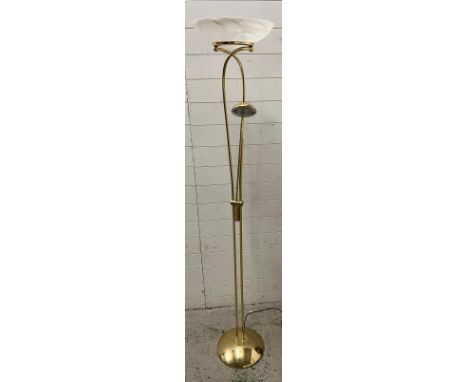 A floor standing brass style lamp 