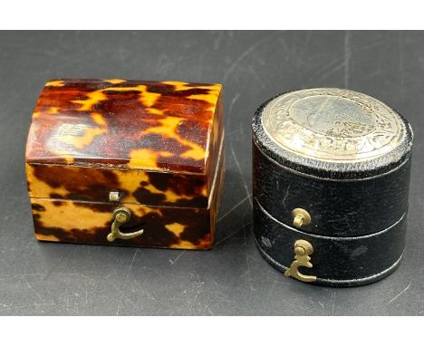 A tortoiseshell ring box along with a leather silver topped ring box