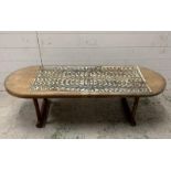 A Mid Century glass topped coffee table with a tribal art underlay to top (H37cm W130cm D48cm)