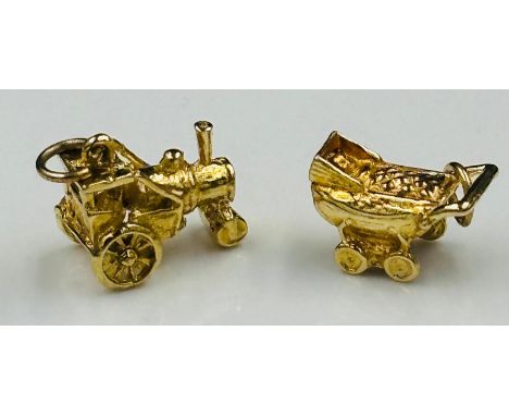 Two 9ct gold charms, a pram and a steam engine with an approximate weight of 4.4g