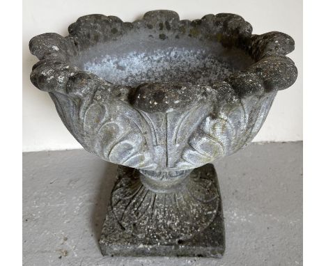 A large 2 sectional pedestal garden planter of classical form with scrolled foliate design and square shaped base. Approx. 44