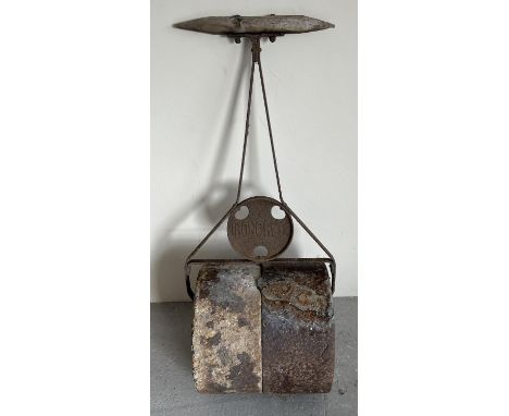 A vintage Ironcrete garden roller with cast iron and wooden handle. Named on ends on concrete rollers and on cast iron handle