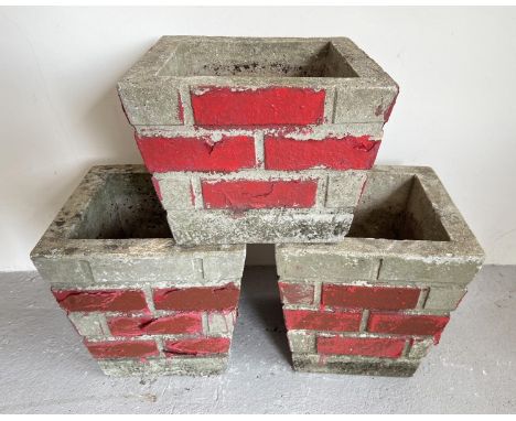3 vintage concrete square shaped garden planters with brick wall design sides. Painted red detail, a pair of taller planters 