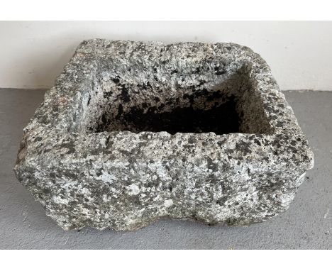 A large and heavy rustic square shaped garden planter. Approx. 26cm tall x 50cm wide. 
