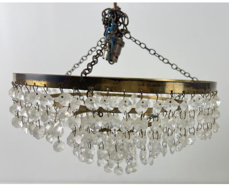 A vintage 4 tier brass &amp; glass chandelier style light fitting with hanging chains. Approx. 29cm diameter. 