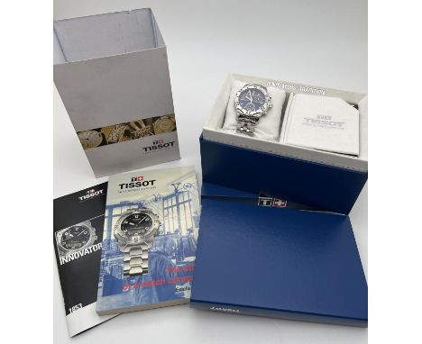 A boxed Tissot T362/462K chronograph wrist watch. Stainless steel case and strap with blue face and silver tone hour markers 