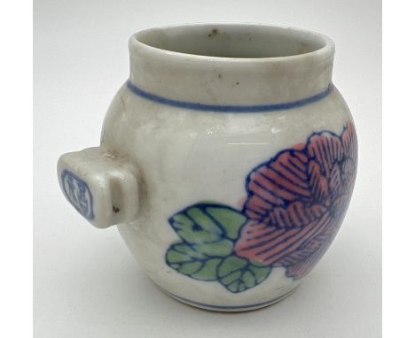 A small Chinese ceramic bird feeder with hand painted floral detail. Approx. 6.5cm tall x 6.5cm diameter. 