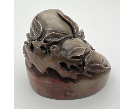 A small Chinese soapstone oval shaped seal with carved detail of fruits &amp; leaves. Approx. 4cm tall. 