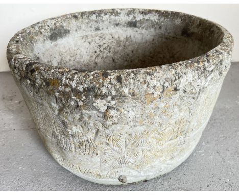 A large circular shaped garden planter in the form of a barrel with ivy leaf decoration. Approx. 26cm tall x 43cm diameter. 