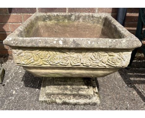 A large square shaped 2 sectional concrete garden planter with pedestal base and rose design border. Approx. 43cm tall x 52cm