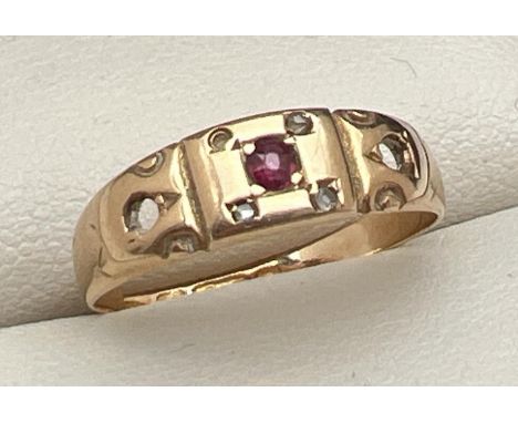 An Art Deco 15ct gold ring set with ruby and diamonds - 2 stones missing, band cut through. Central round cut ruby in a squar