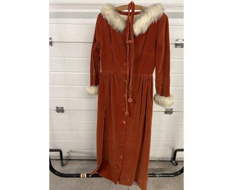 A vintage handmade burnt orange velvet coat dress with gathered waist, front button fastening, faux fur collar and cuffs and 