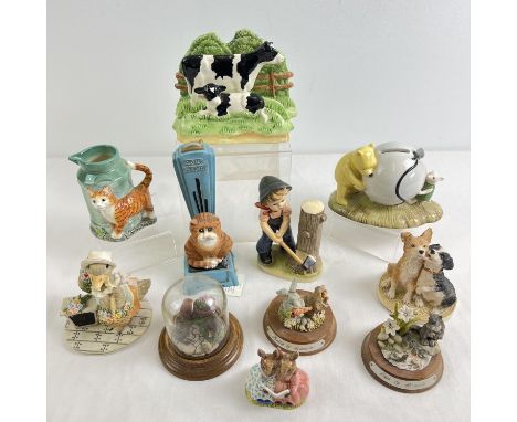 A box of assorted ceramic and resin collectable figurines to include Royal Doulton. Lot includes Winnie-the-Pooh money box, B