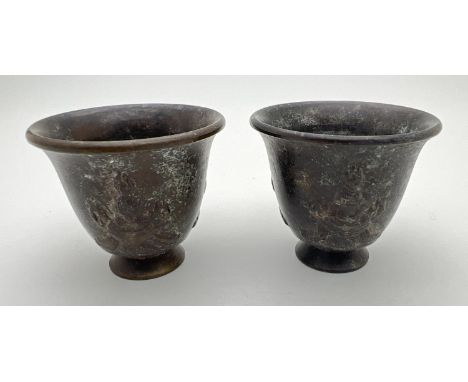 A pair of small Chinese bronze footed incense pots with embossed detail to outer bowl. Impressed signature mark to underside.