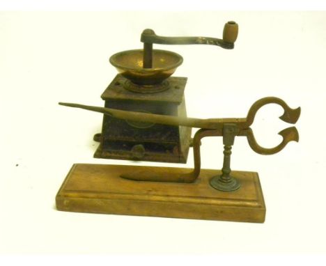 A VICTORIAN CAST IRON AND BRASS COFFEE MILL BY BALDWIN SON & CO, STOURPORT AND A PAIR OF VICTORIAN STEEL SUGAR CUTTERS ON OAK