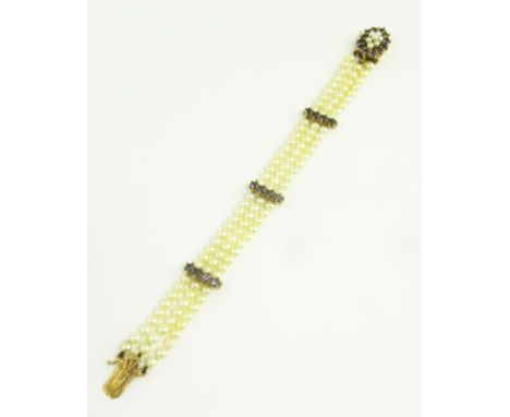 A CULTURED PEARL THREE ROW BRACELET WITH AMETHYST THREE STONE BATONS AND SIMILAR CLASP, IN GOLD, MARKED 9CT