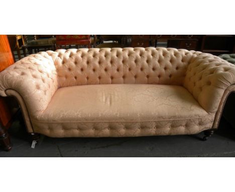 A VICTORIAN CHESTERFIELD SOFA RE UPHOLSTERED IN BUTTONED PINK BROCADE AND A SIMILAR ARMCHAIR