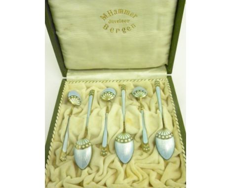 A SET OF SIX NORWEGIAN SILVER GILT AND BLUE GUILLOCHE ENAMEL COFFEE SPOONS  BY N HAMMER, BERGEN, CASED, 2OZS 10DWTS