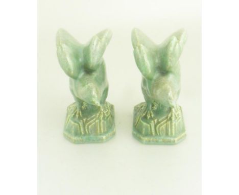 A PAIR OF POOLE POTTERY SYLVAN WARE MODELS OF A FALCON